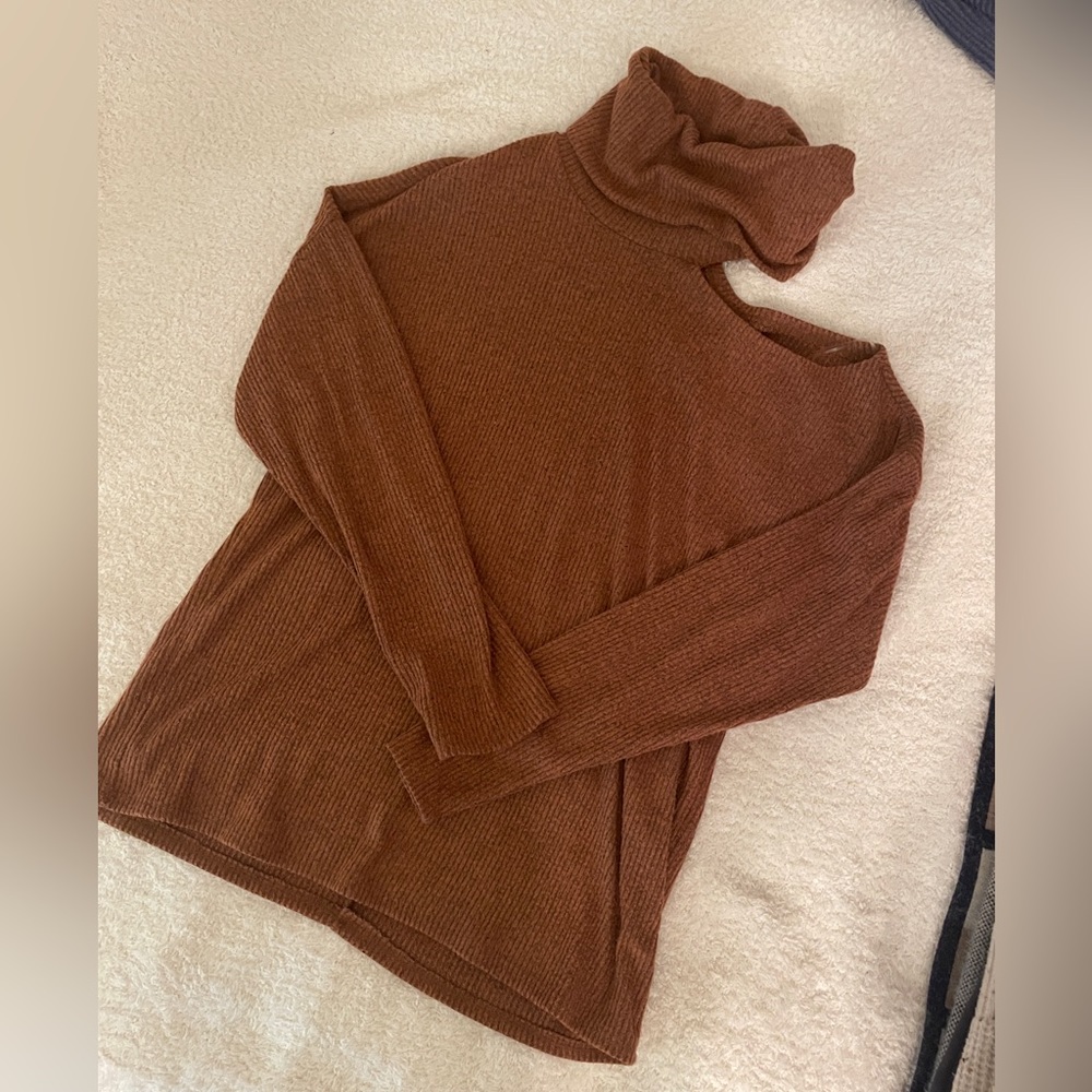 Burnt orange turtle neck with open shoulder detail